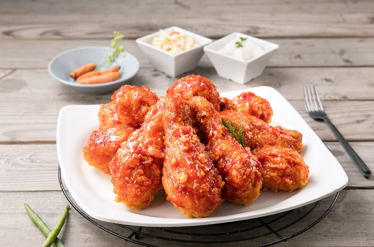 Korean fried chicken with crispy golden coating served on a white plate